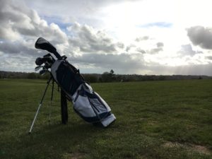 golf bag sitting on the course